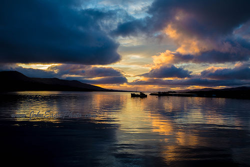 Fishing boat in Kenmare Bay sunset